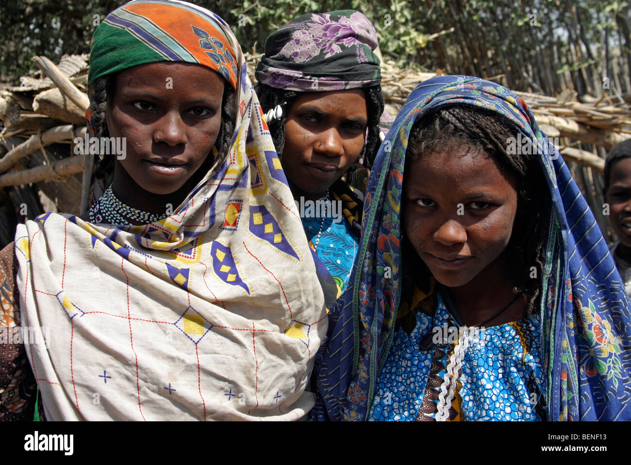 Close up of three young native black women in traditional dress wearing headscarfs in Chad, Central Africa Stock Photo