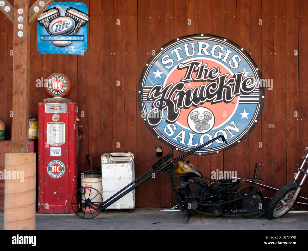 Old motorbike, sign and gas pump in Sturgis, South Dakota Stock Photo