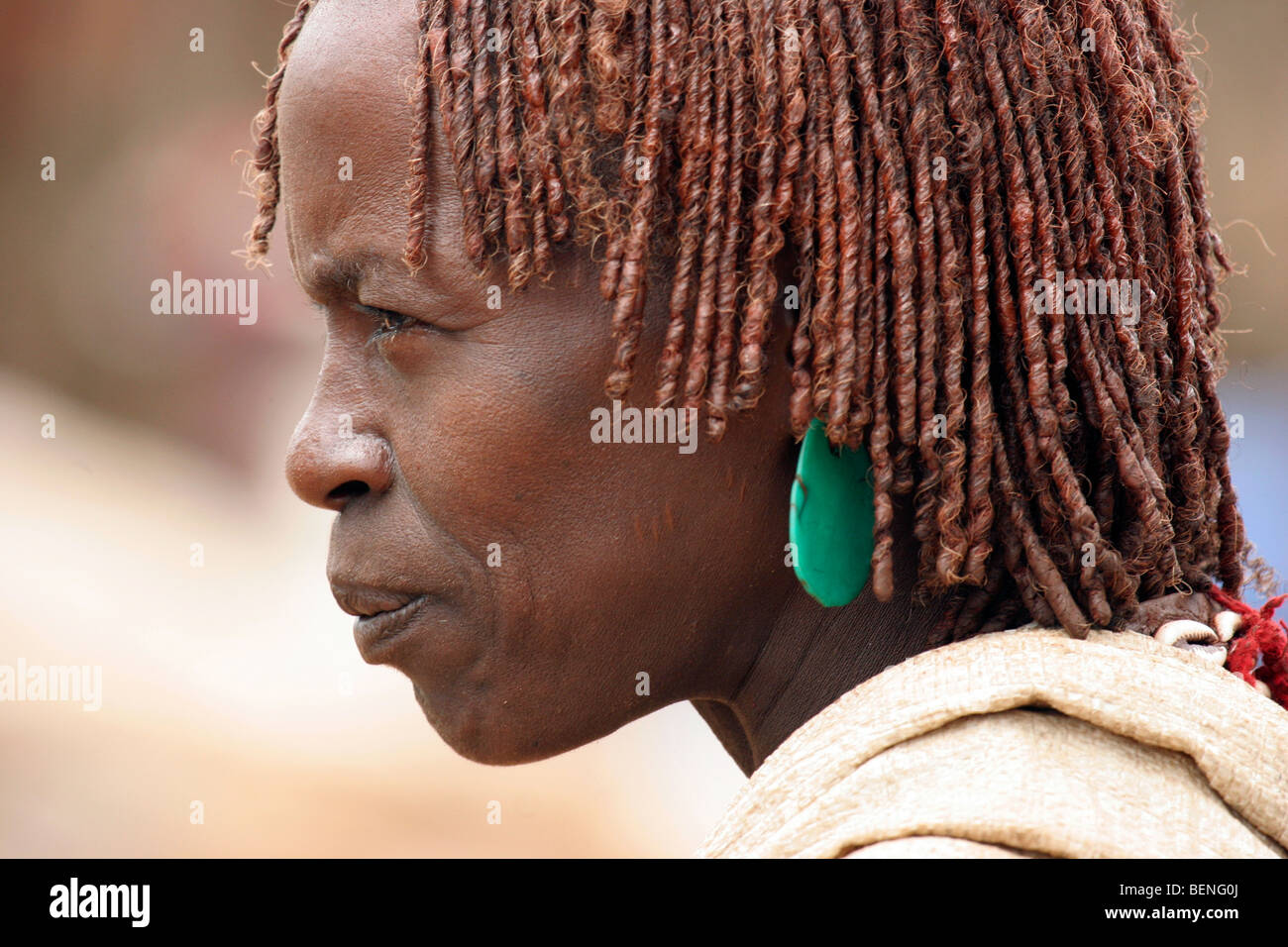 Portrait of woman of the Hamar tribe with traditional red headdress, Dimeka, South Omo / Debub Omo, Ethiopia, East Africa Stock Photo