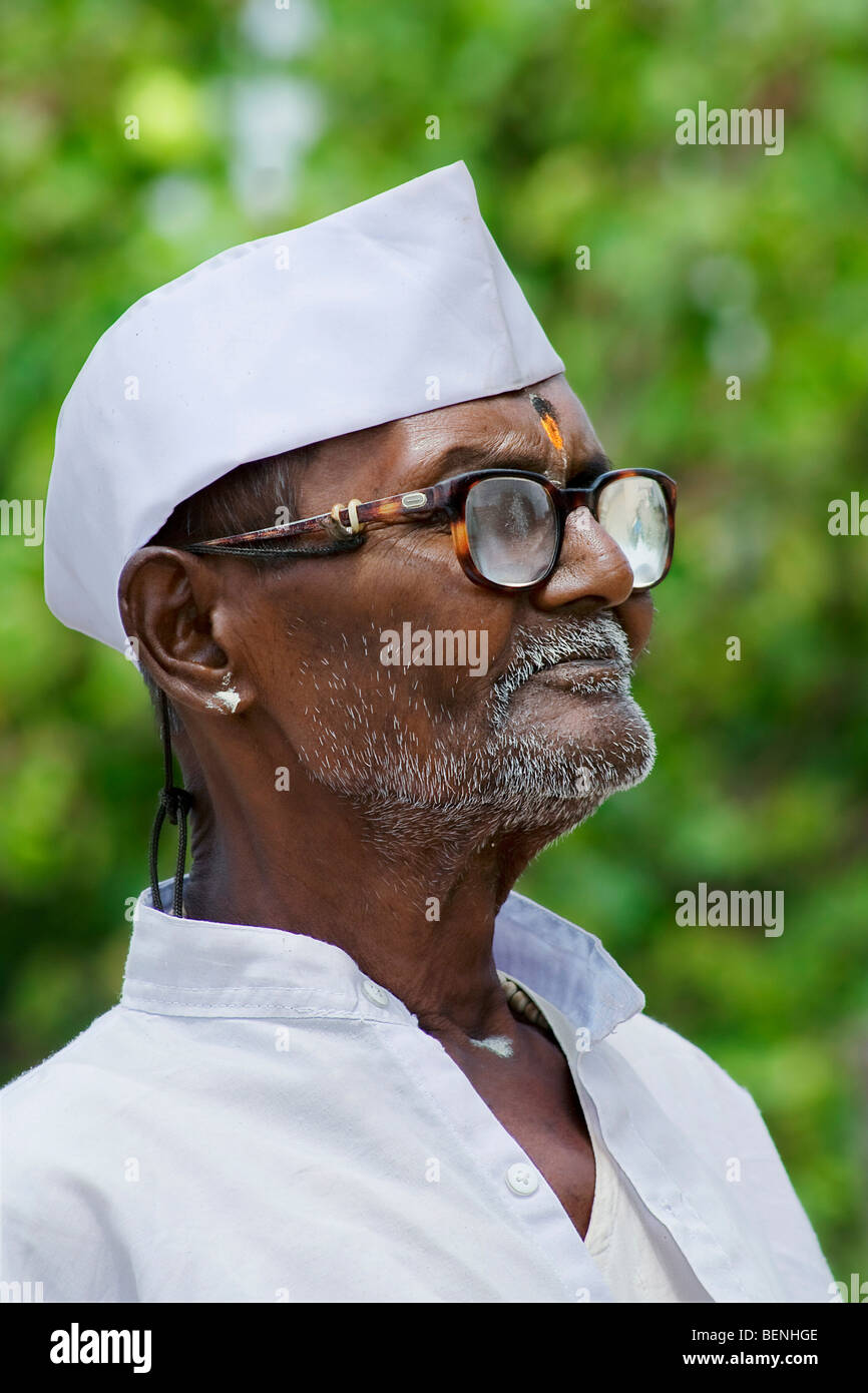 A portrait of an old man in Gandhi attire Stock Photo