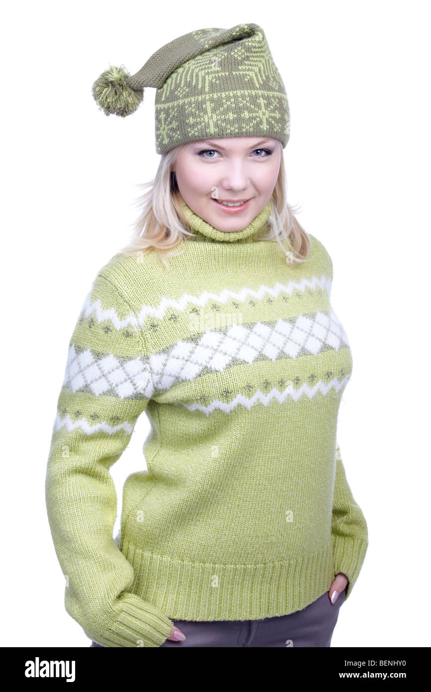 portrait of beautiful slavonic blonde girl in green sweater and winter cap with bob Stock Photo