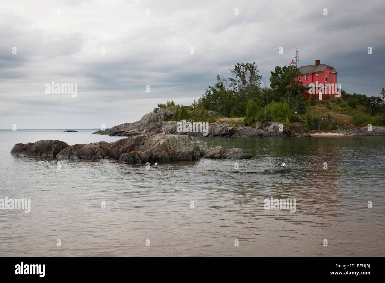 Red Marquette Maritime Museum and Lighthouse on Lake Superior in Michigan USA nobody hi-res Stock Photo