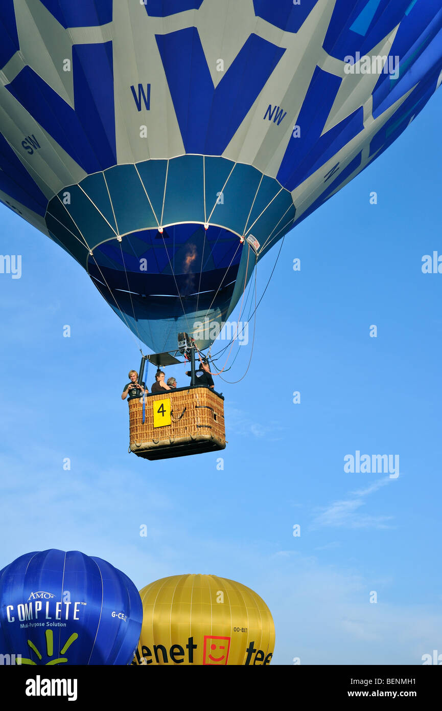Balloonists / Aeronauts in hot-air balloons during ballooning meeting Stock Photo