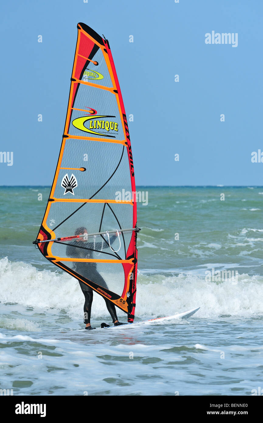 Windsurfer in wetsuit windsurfing on the North Sea Stock Photo