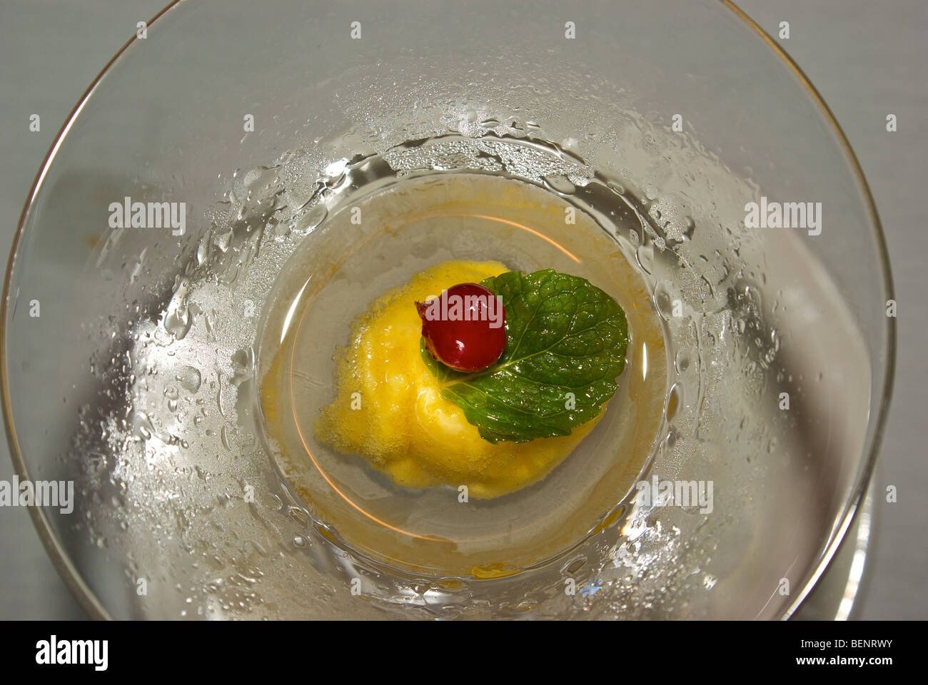 Condensation covered martini glass with Hawaiian passion fruit sorbet