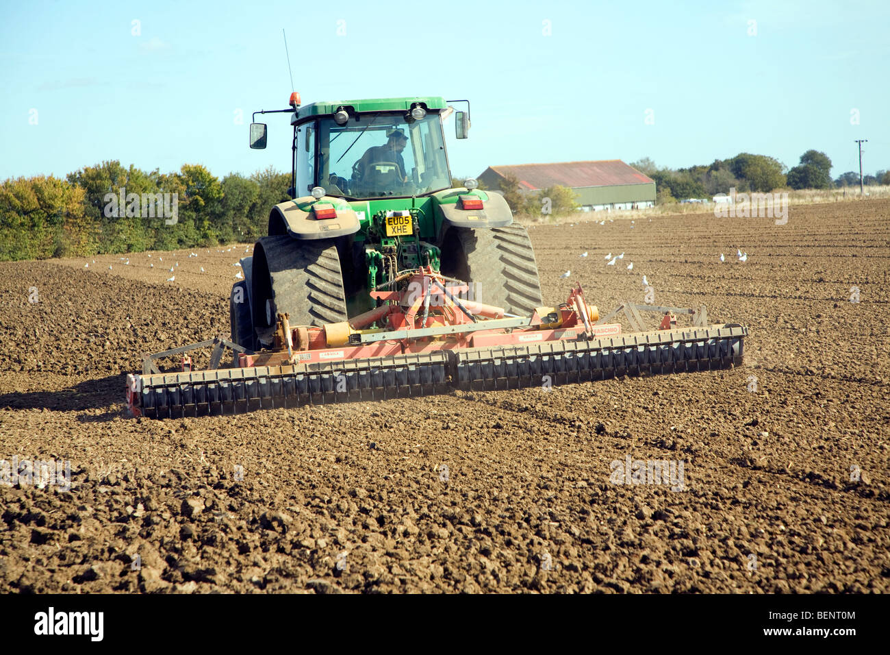 Tractor harrowing field, Parham, Suffolk, England Stock Photo Alamy