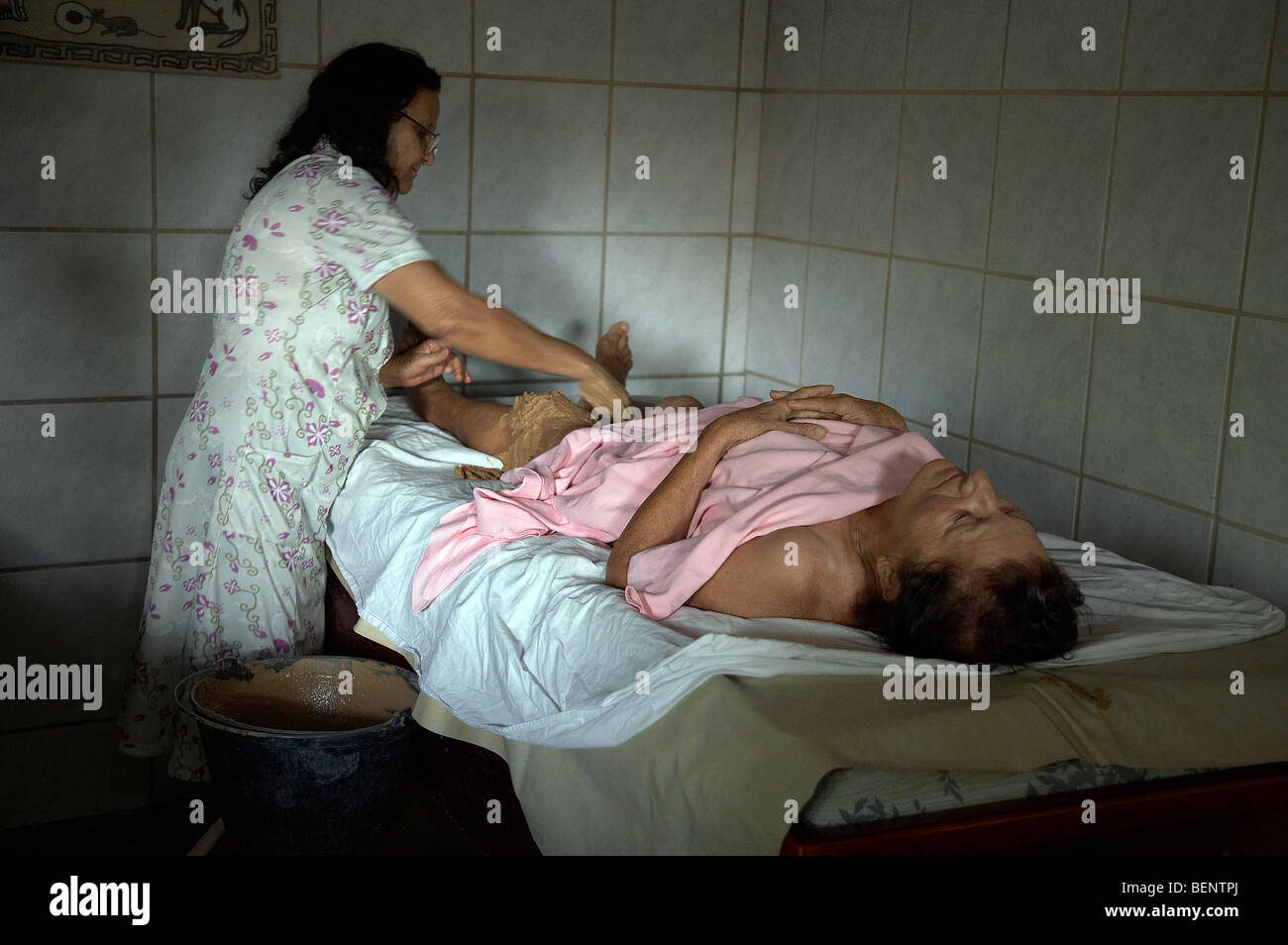 BRAZIL Afya Holistic Healing Center for Women in Joao Pessoa, Paraiba State. Woman receiving mud therapy. PHOTO by SEAN SPRAGUE Stock Photo