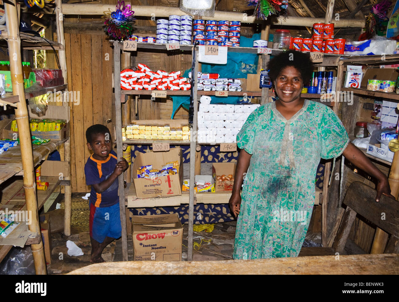 Pacific Islander shopkeeper inside small village store with limited supplies of groceries. Please click for details. Stock Photo