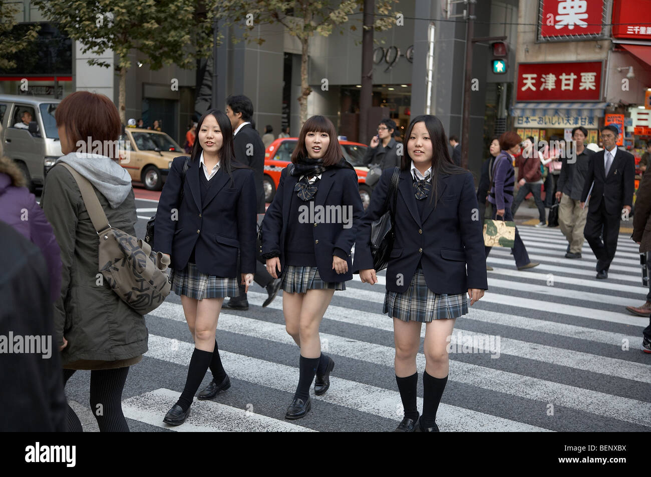 JAPAN Shibuya, Tokyo. High school girls in their uniform. photo by Sean Spraqgue 2008 Stock Photo