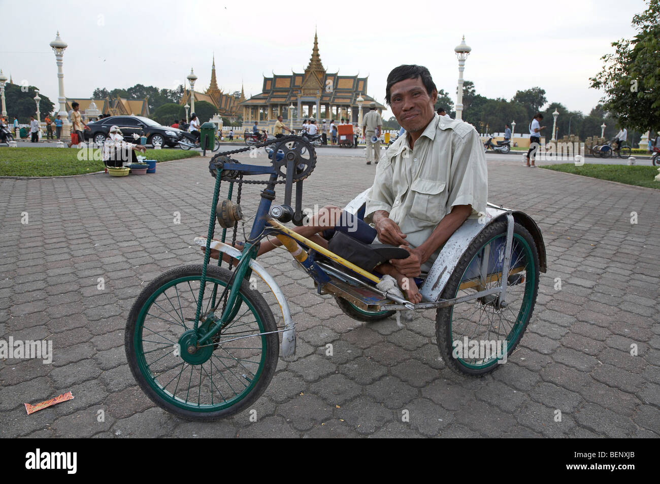 CAMBODIA Sunday in Phnom Penh. Polio victim with special tyricycle. PHOTOGRAPH by SEAN SPRAGUE 2008 Stock Photo