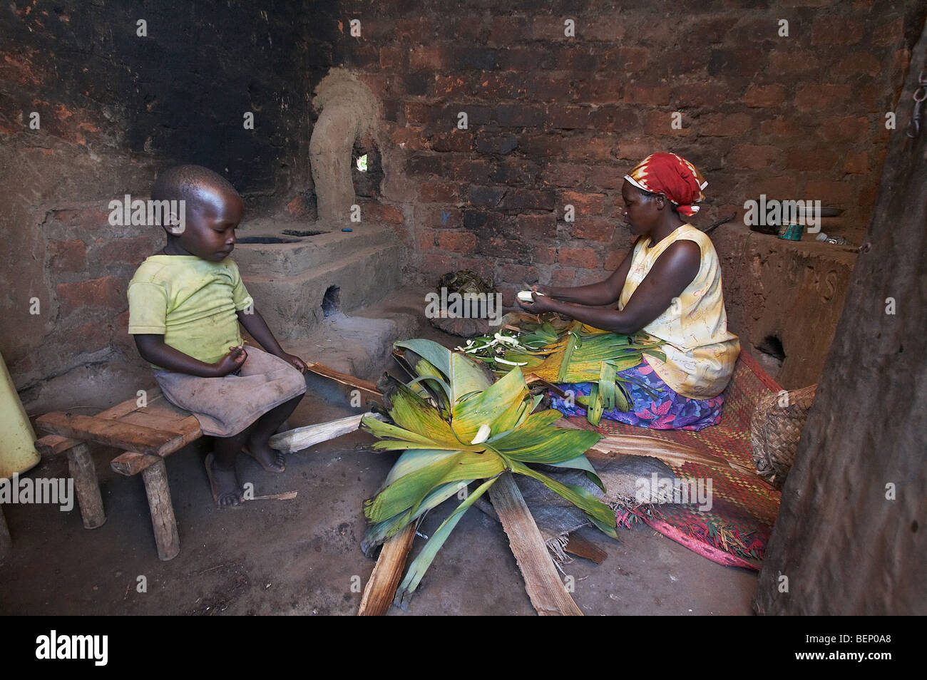 UGANDA Woman preparing food in her kitchen Stock Photo Alamy