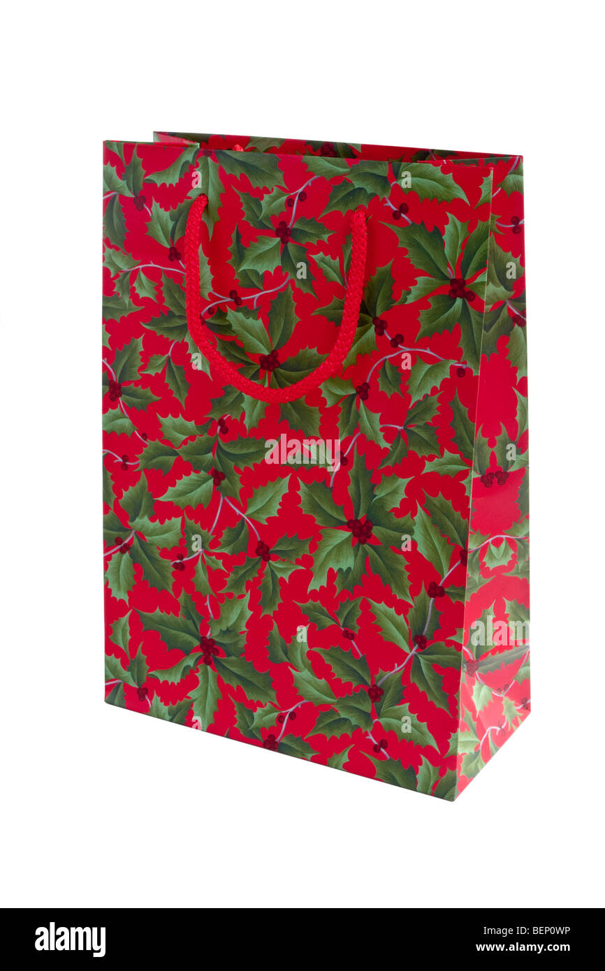 Red Christmas Gift Bag With Tissue Paper Isolated On White