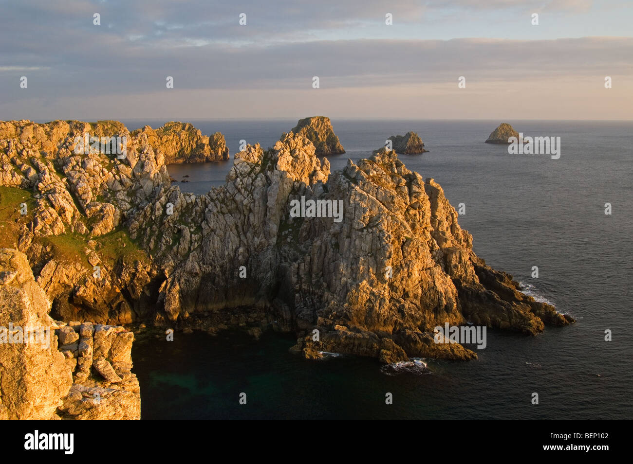 Sea cliffs at sunset at the Pointe de Pen-Hir, Finistère, Brittany, France Stock Photo