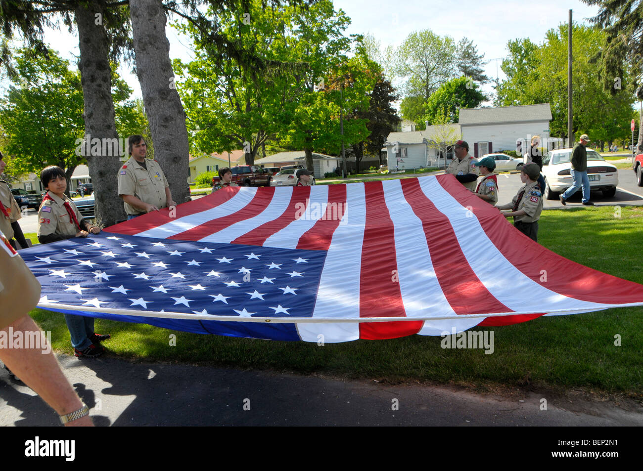 Scouts carry large american flag in Memorial Day parade Stock Photo
