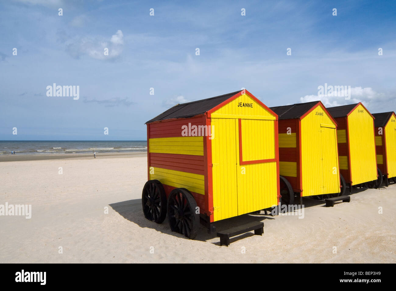 Row Of Colourful Striped Beach Cabins On Wheels Along The North