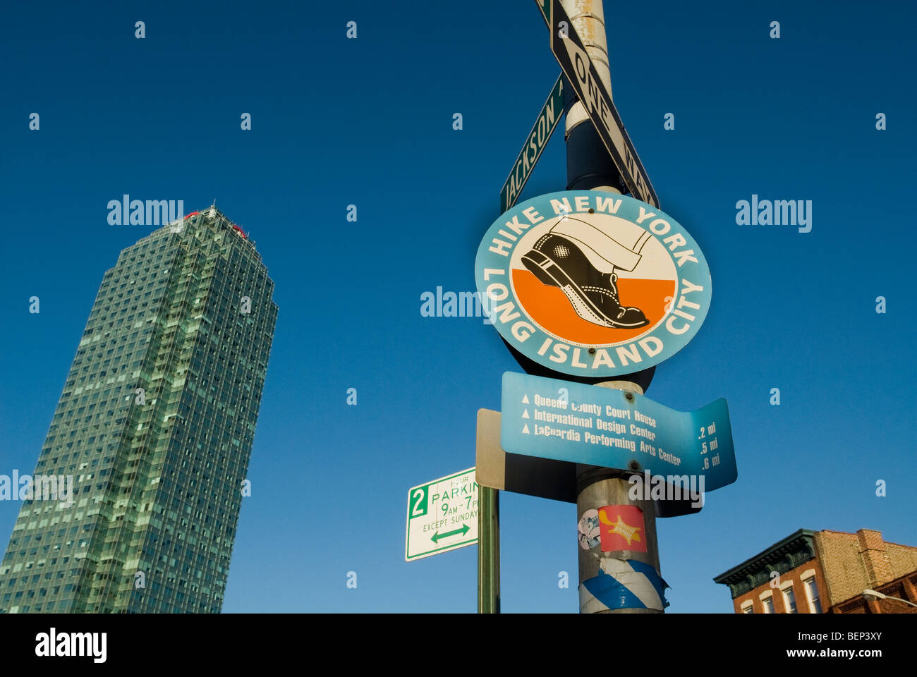 A sign promoting hiking and exercise and the Citigroup Center building in Court Square in Long Island City in Queens in New York Stock Photo