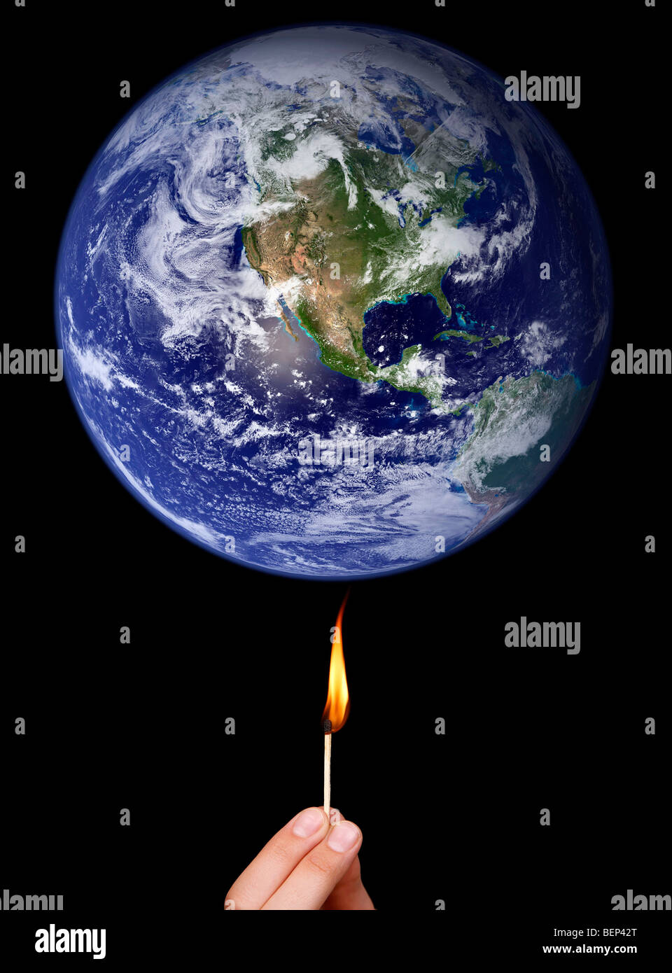 Global warming concept: match stick burning the Earth (Nasa imagery). Stock Photo