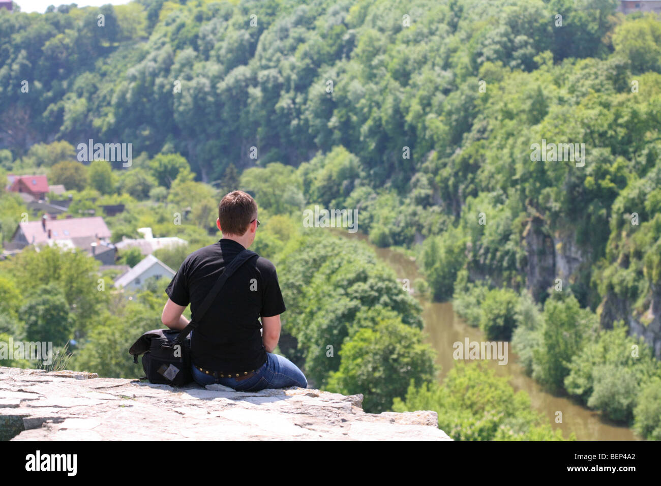 Sitting alone at the top of the precipice Stock Photo