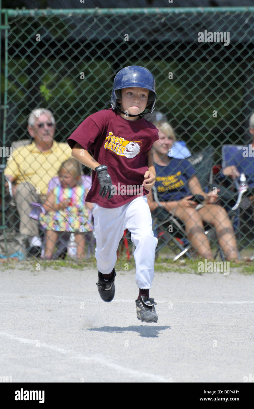 Little league baseball action with 8 and 9 year old players Stock Photo