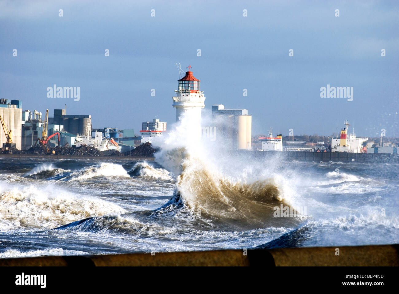 Lighthouse in stormy windy seas, New Brighton River Mersey Liverpool Stock Photo