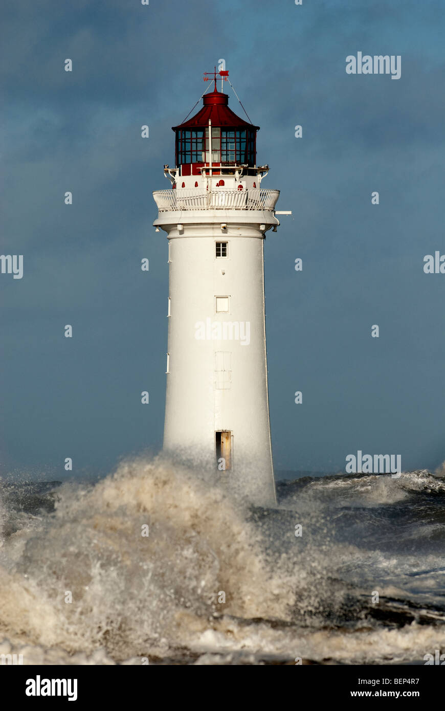 Lighthouse in stormy windy seas, New Brighton River Mersey Liverpool Stock Photo