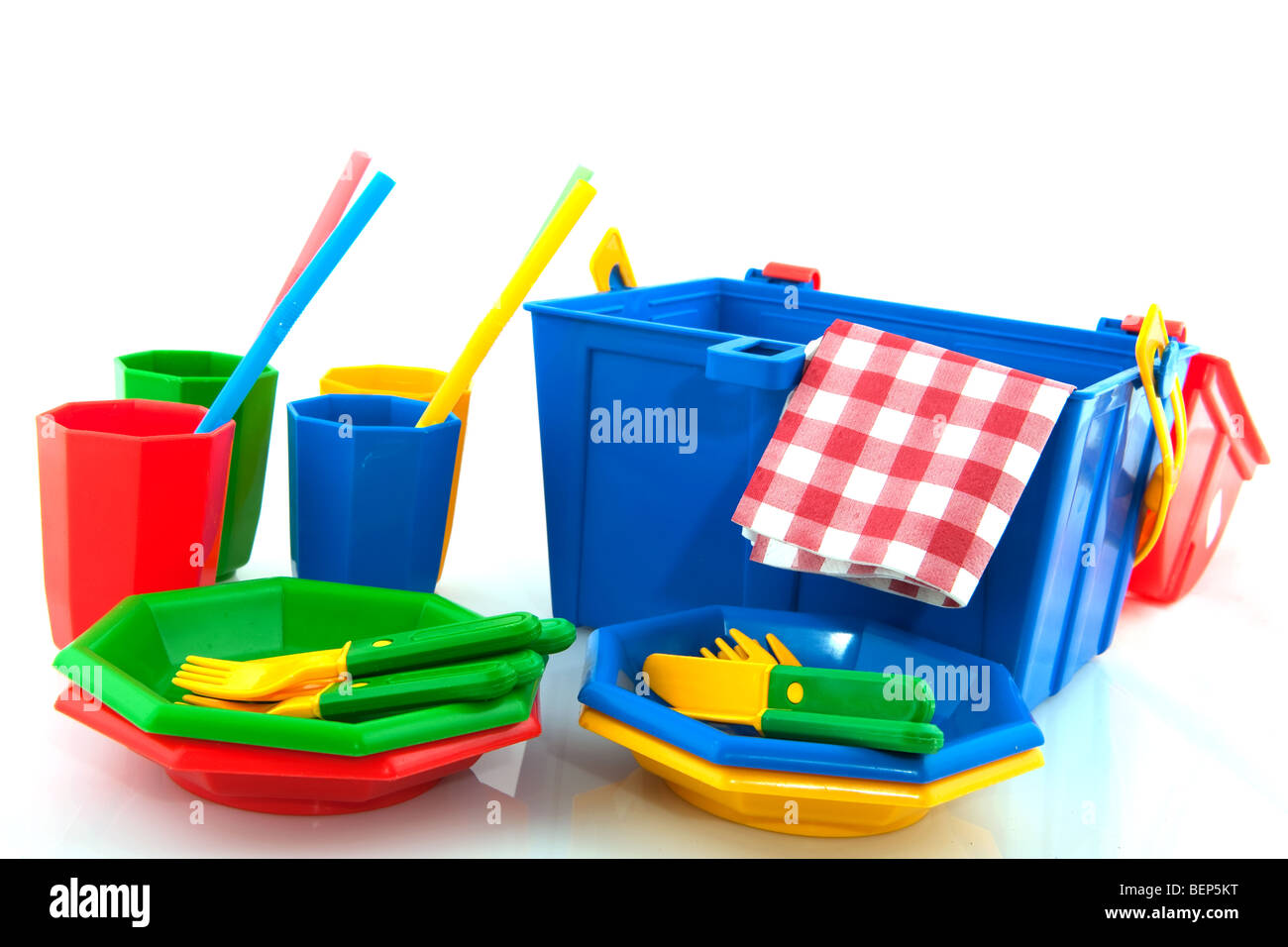 colorful plastic picnic set with drinking straws isolated over white