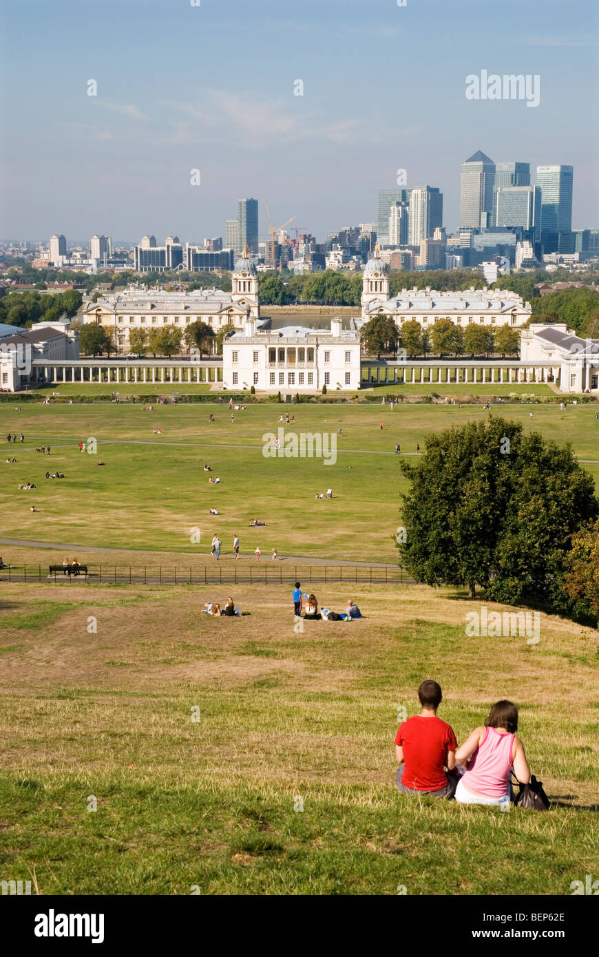 View from Greenwich Park, the National Maritime Museum with the Queens House and the Royal Naval College, Canary Wharf behind Stock Photo