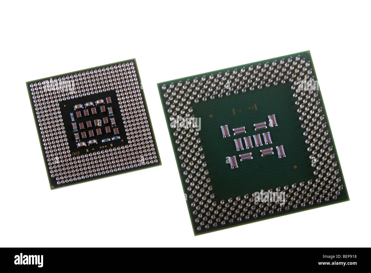 One old and one modern computer central processors. Stock Photo