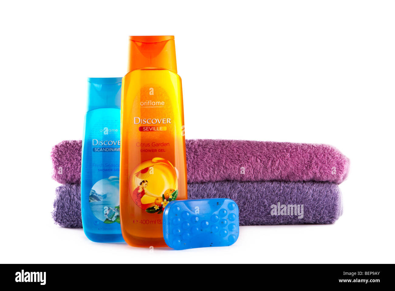Bath and shower accessories: two bottle of the shower gel, one piece of soap, two towels. Stock Photo