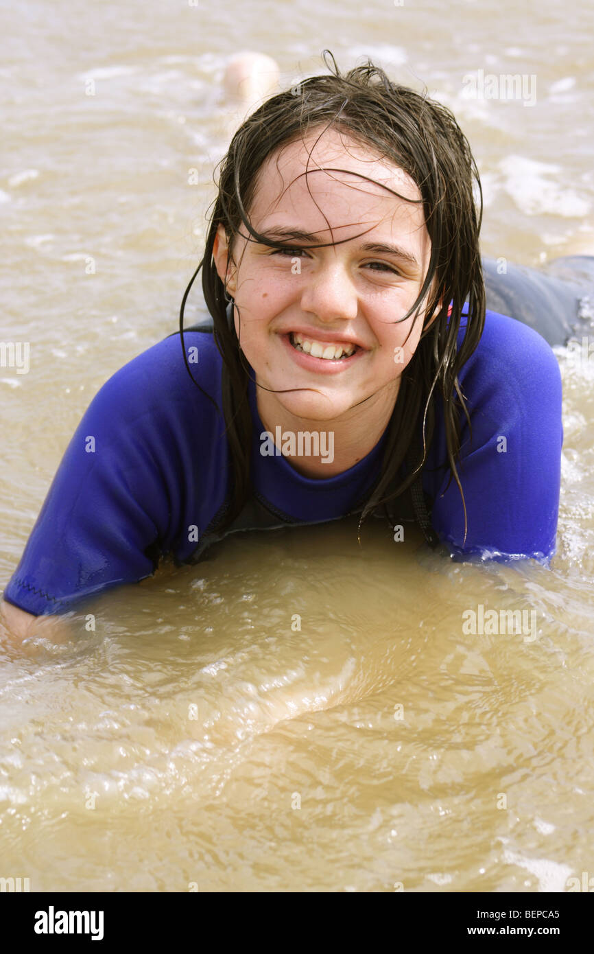 beach babe in a wetsuit Stock Photo Alamy