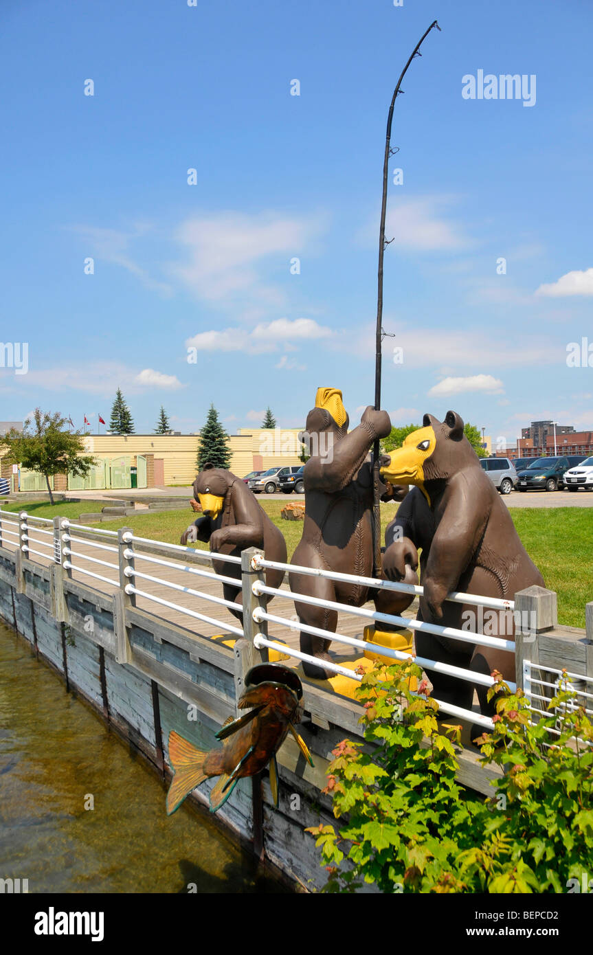 Statue of three bears fishing in Roberta Bondar Park along St. Mary's