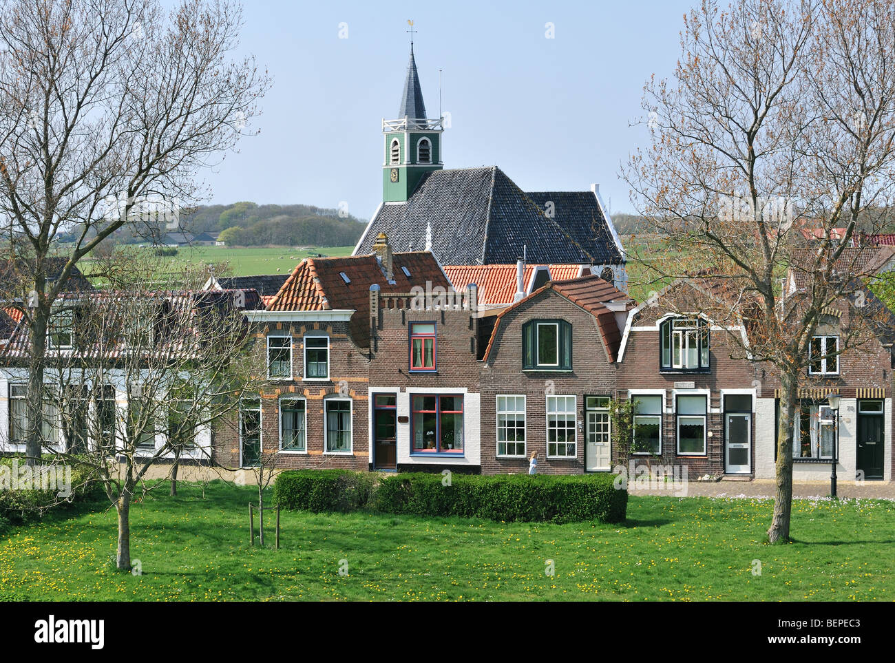 The Sailor Church And Traditional Houses In The Village Oudeschild