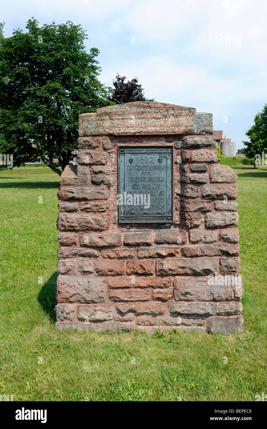 Monument honoring first white men to see St. Mary's Rapids Sault Ste. Marie Ontario Canada Stock Photo