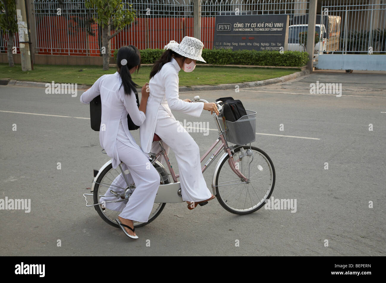 VIETNAM Saigon girls on bicycle. photograph by Sean Sprague 2008 Stock ...
