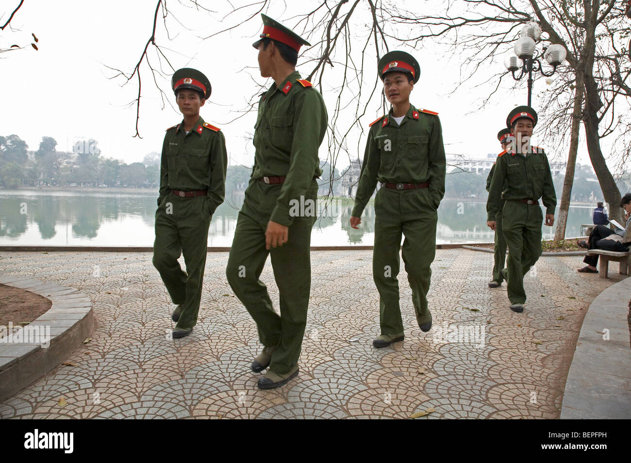 VIETNAM Soldiers at Hoan Kiem Lake, Hanoi. photograph by Sean Sprague 2008 Stock Photo