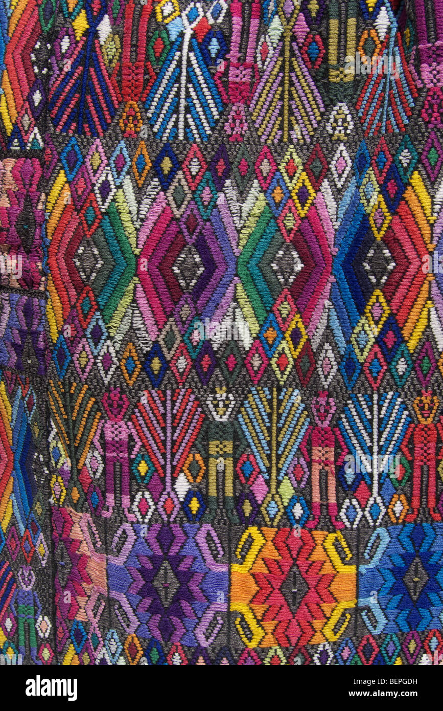 GUATEMALA  Market at Santiago de Atitlan, Detail of a huipil, or woman's blouse with intricate embroidery on hand weaving Stock Photo