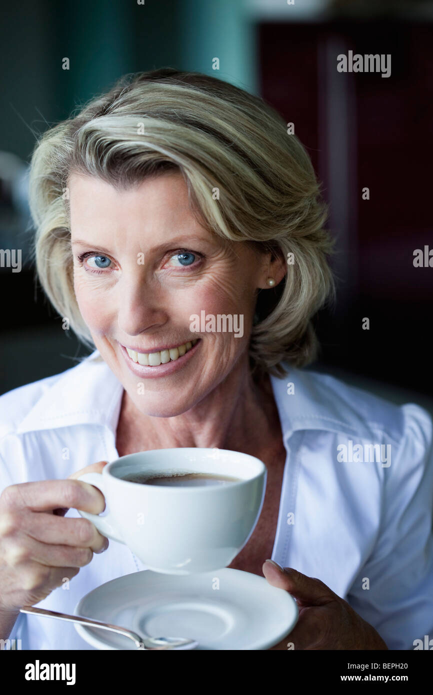 Sipping senior woman holding hi-res stock photography and images - Alamy