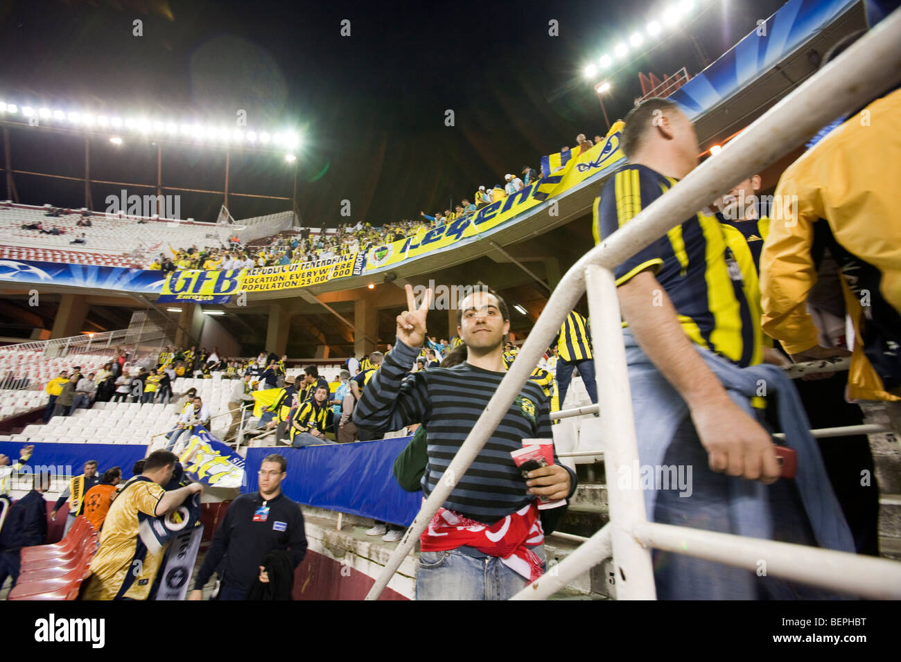 Fenerbahce fans. UEFA Champions League first knockout round game (second leg) between Sevilla FC (Seville, Spain) and Stock Photo