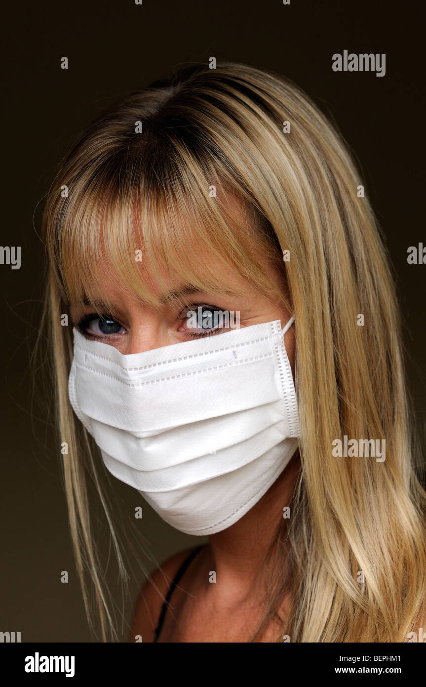 Portrait of a woman wearing a medical face mask Stock Photo - Alamy