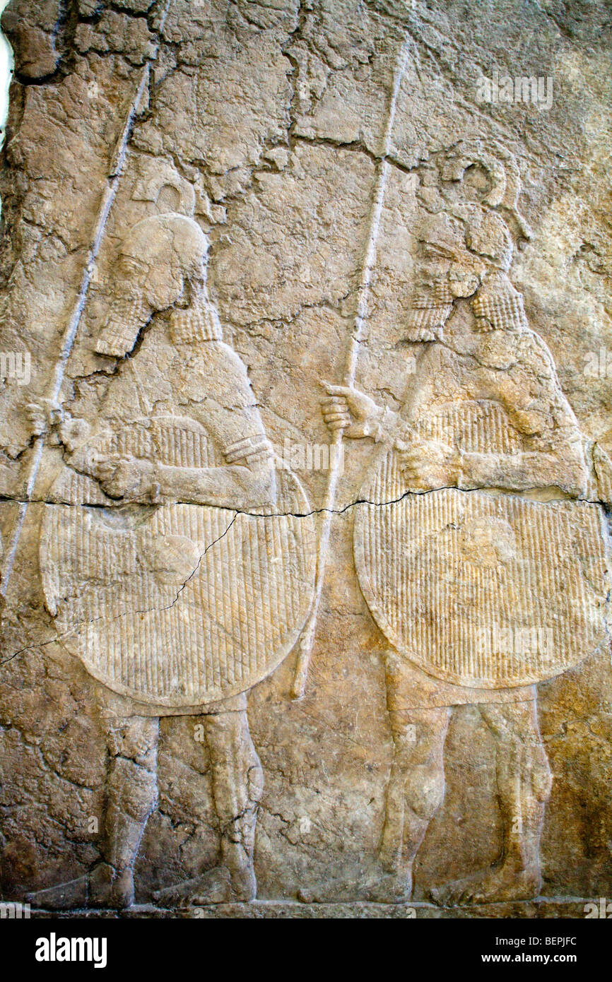 Assyrian soldiers marching, bas-relief from the king Sennacherib palace (8th-7th century BC), Pergamon Museum, Berlin, Germany Stock Photo