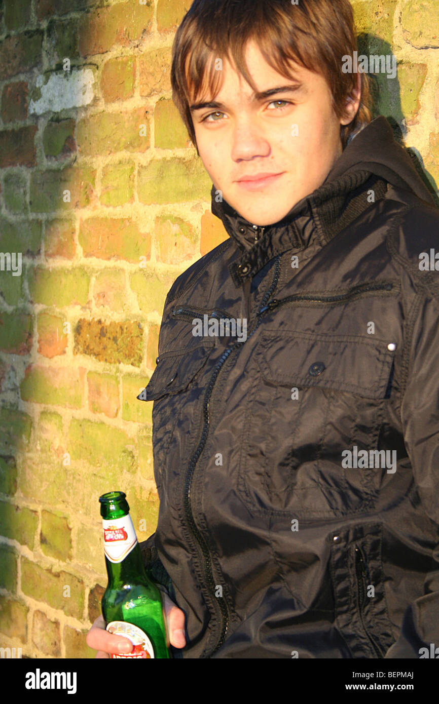 Boy drinking alcohol Stock Photo