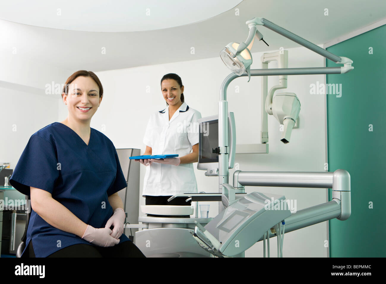 A female dentist and dental nurse Stock Photo