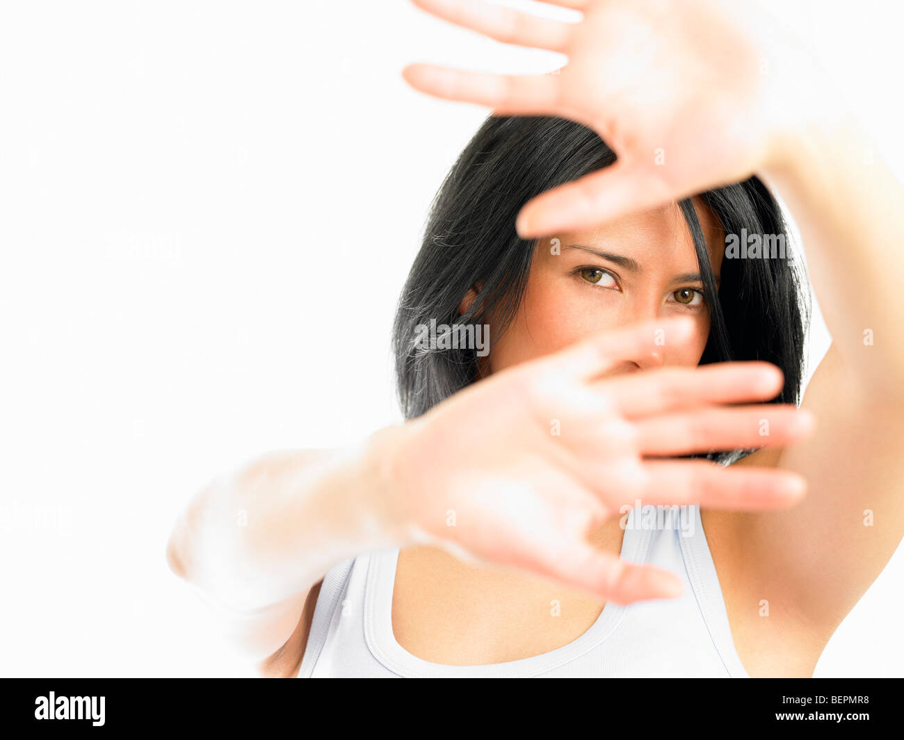 Woman with hands in the way of the shot Stock Photo