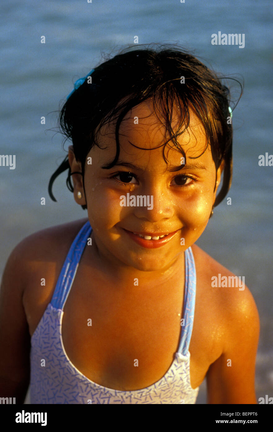 1, one, Mexican girl, Mexican, girl, young girl, girl, child, face, eye contact, front view, Akumal, Quintana Roo State, Yucatan Peninsula, Mexico Stock Photo