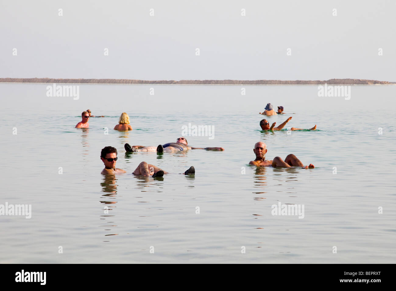 Israel, Dead Sea People float in the heavy water of the Dead Sea Stock