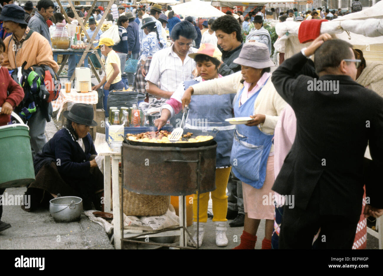 Fried food seller in Ecuadorian local market. Stock Photo
