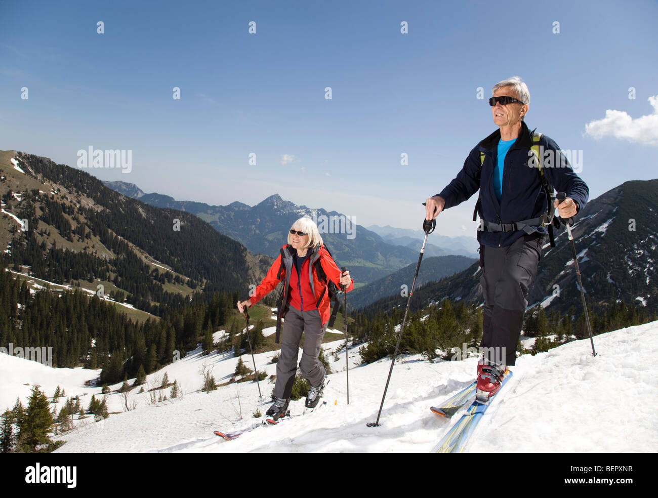 senior couple on ski tour in mountains Stock Photo
