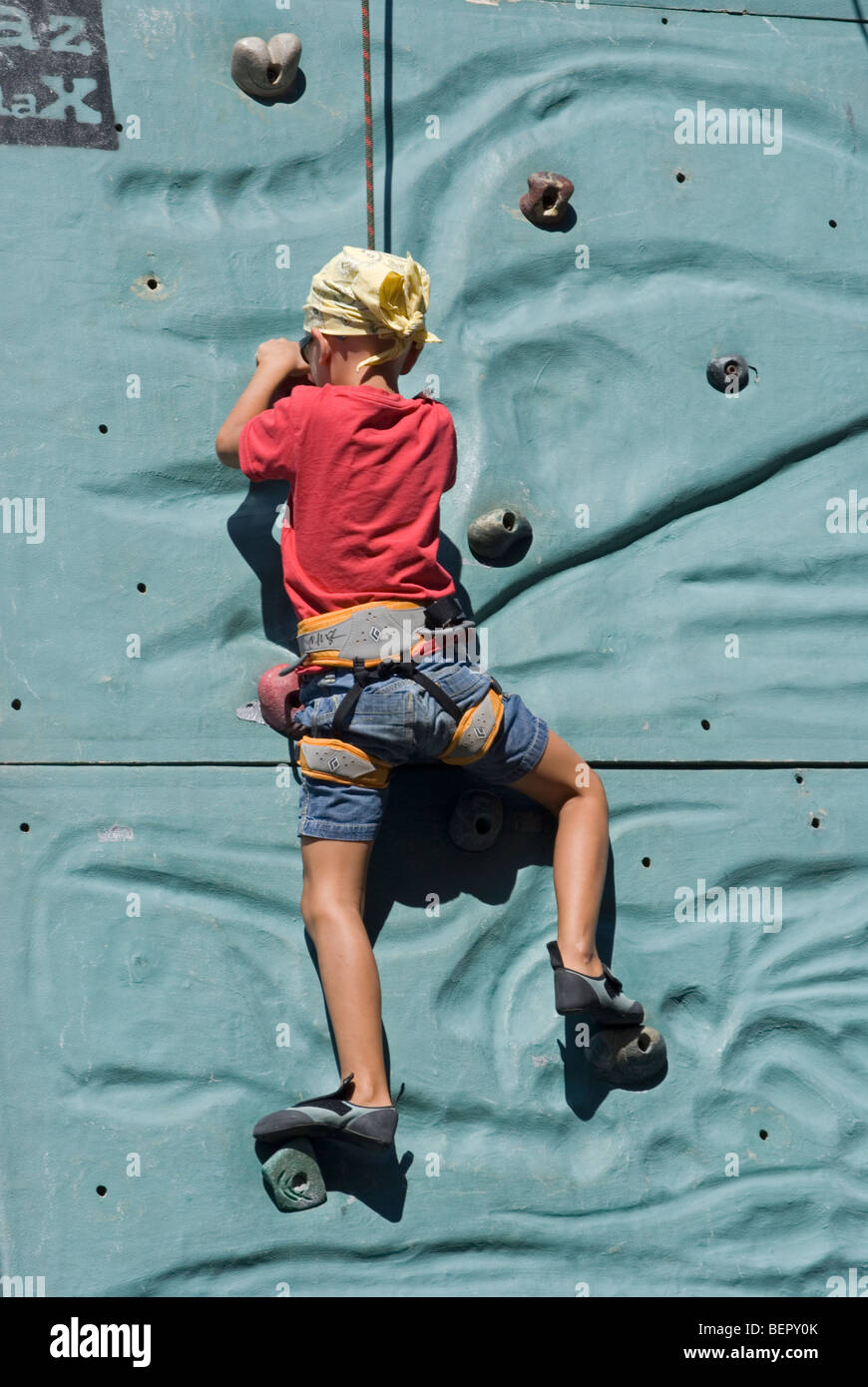 young rock climber in action Stock Photo