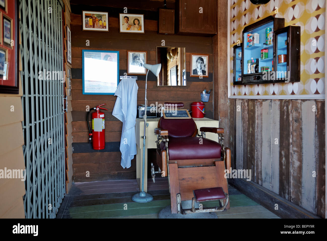 Vintage barber shop. Old wooden-clad barber shop museum exhibit. Hua Hin, Thailand, S. E. Asia Stock Photo