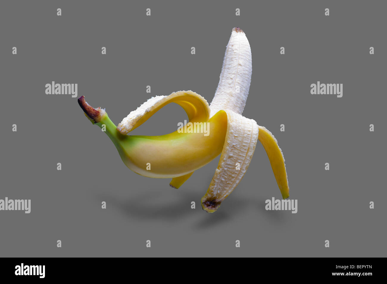 Nice floating banana on grey background with shadow under it Stock ...